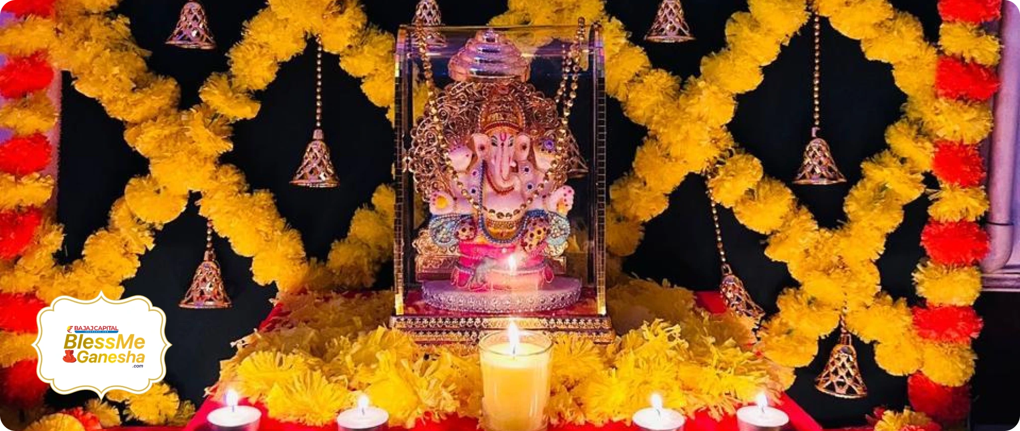 Ganesha surrounded by flowers, bells and lamps